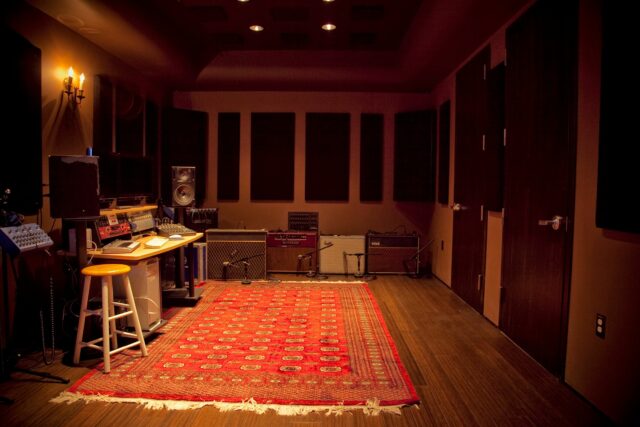 Empty recording studio with black acoustic panels on walls