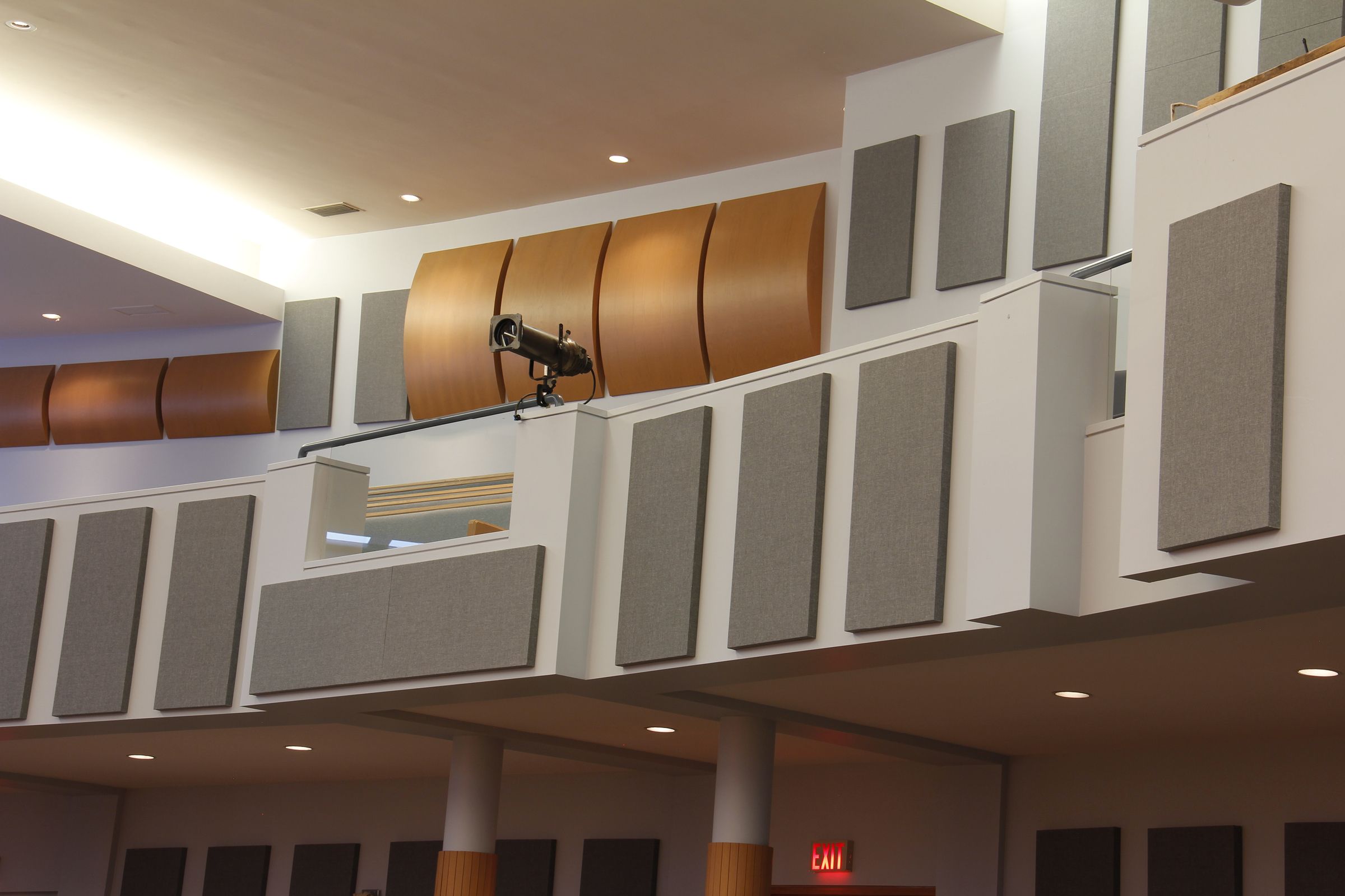 Grey acoustic panels on back wall and balcony of church