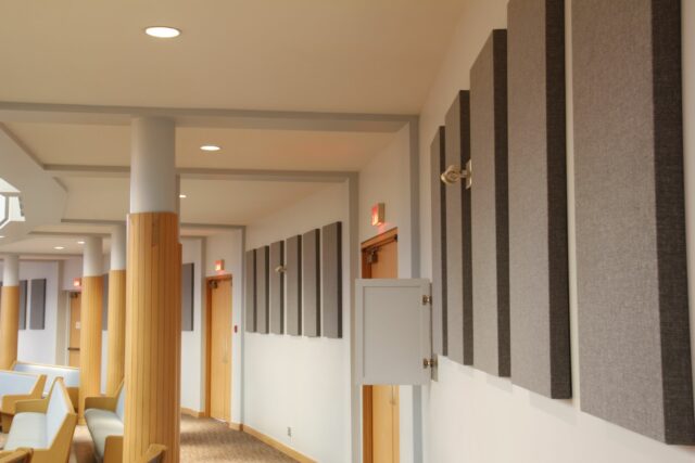 Close up of grey acoustic wall panels on back wall of church