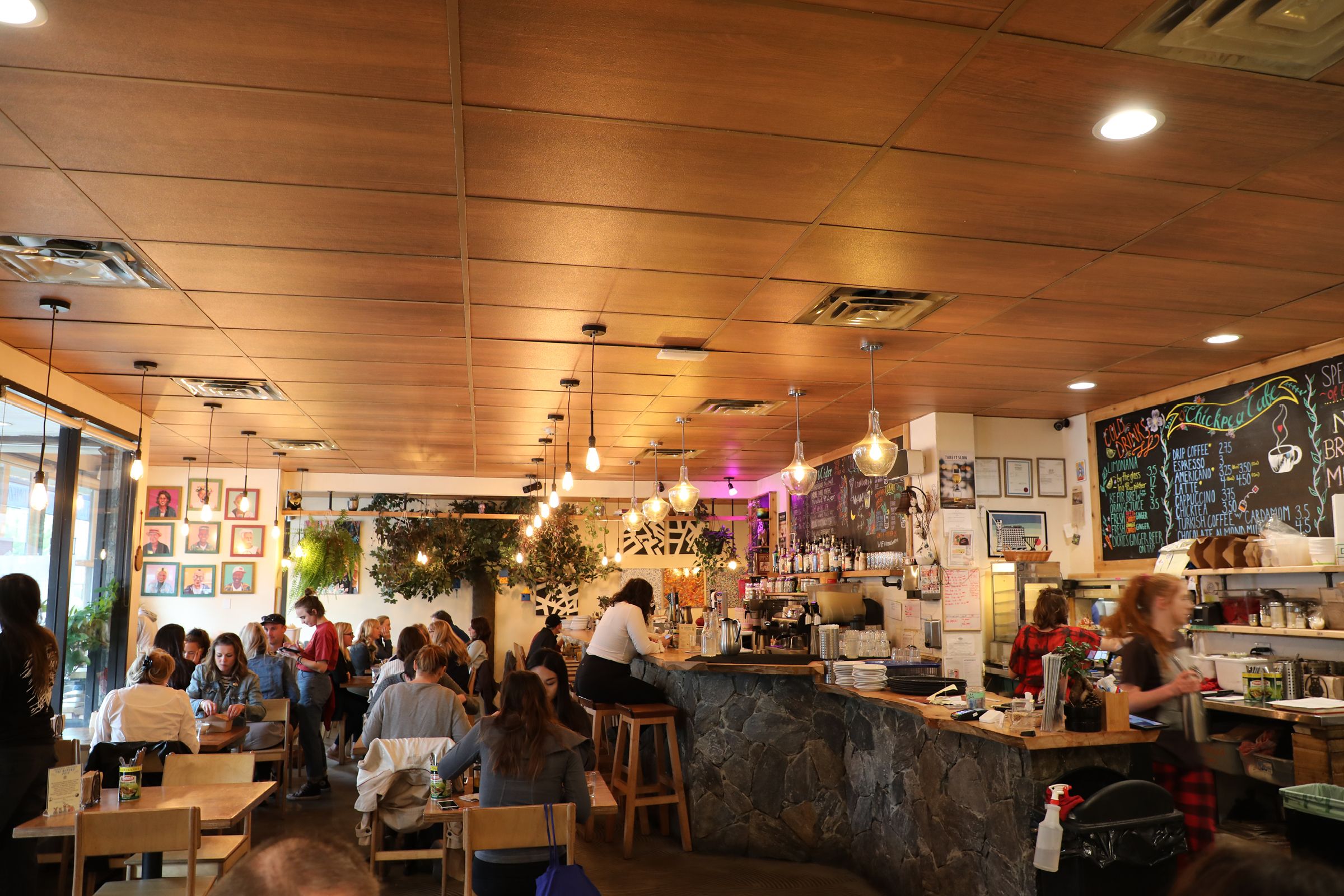 Busy Cafe with a brown, wood design acoustic T-bar ceiling.