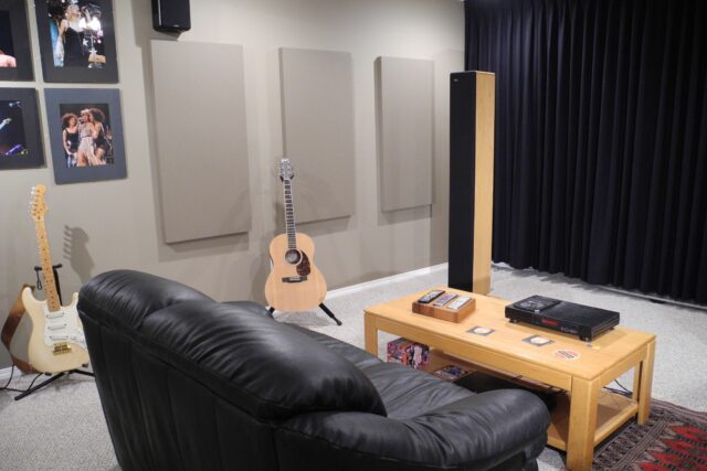 Home theatre with grey acoustic panels on side walls