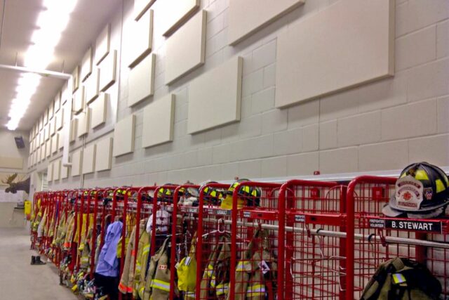 Fire hall with white wall and white acoustic panels installed