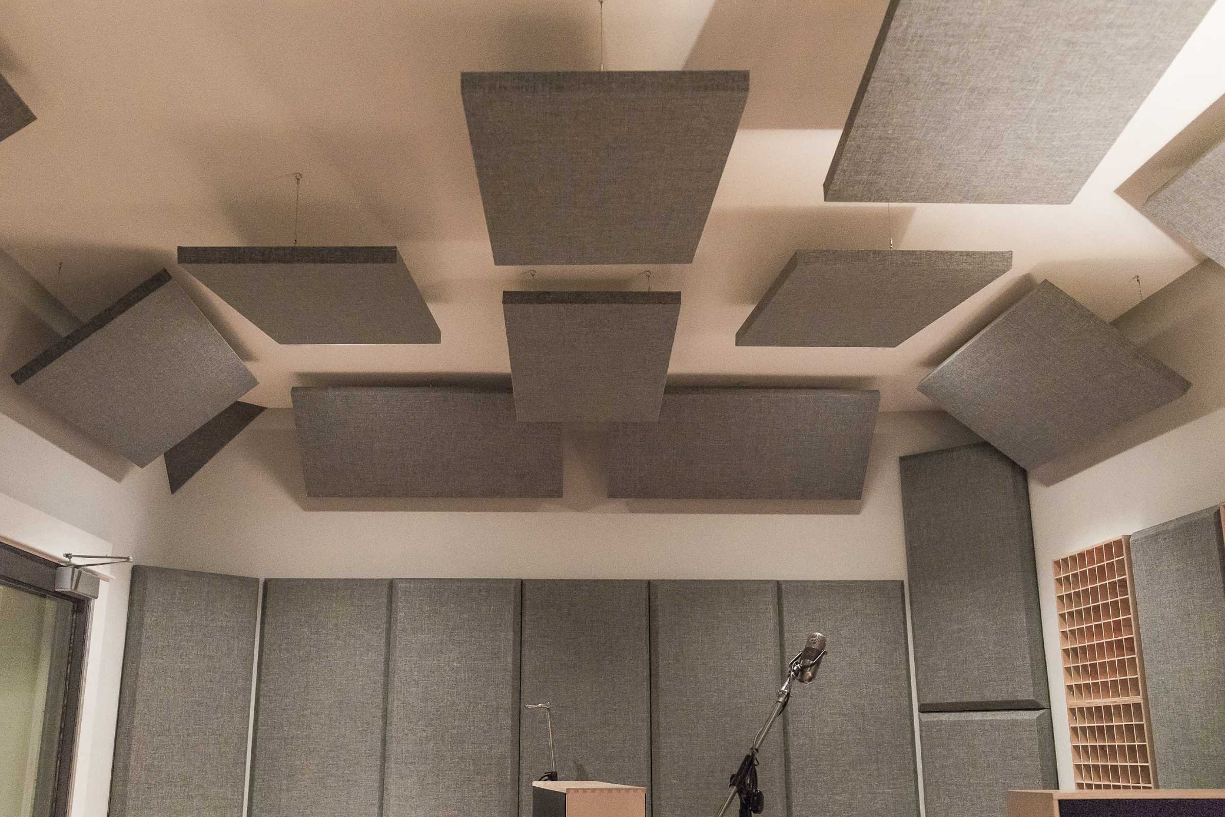 Recording studio ceiling with grey hanging acoustic panels