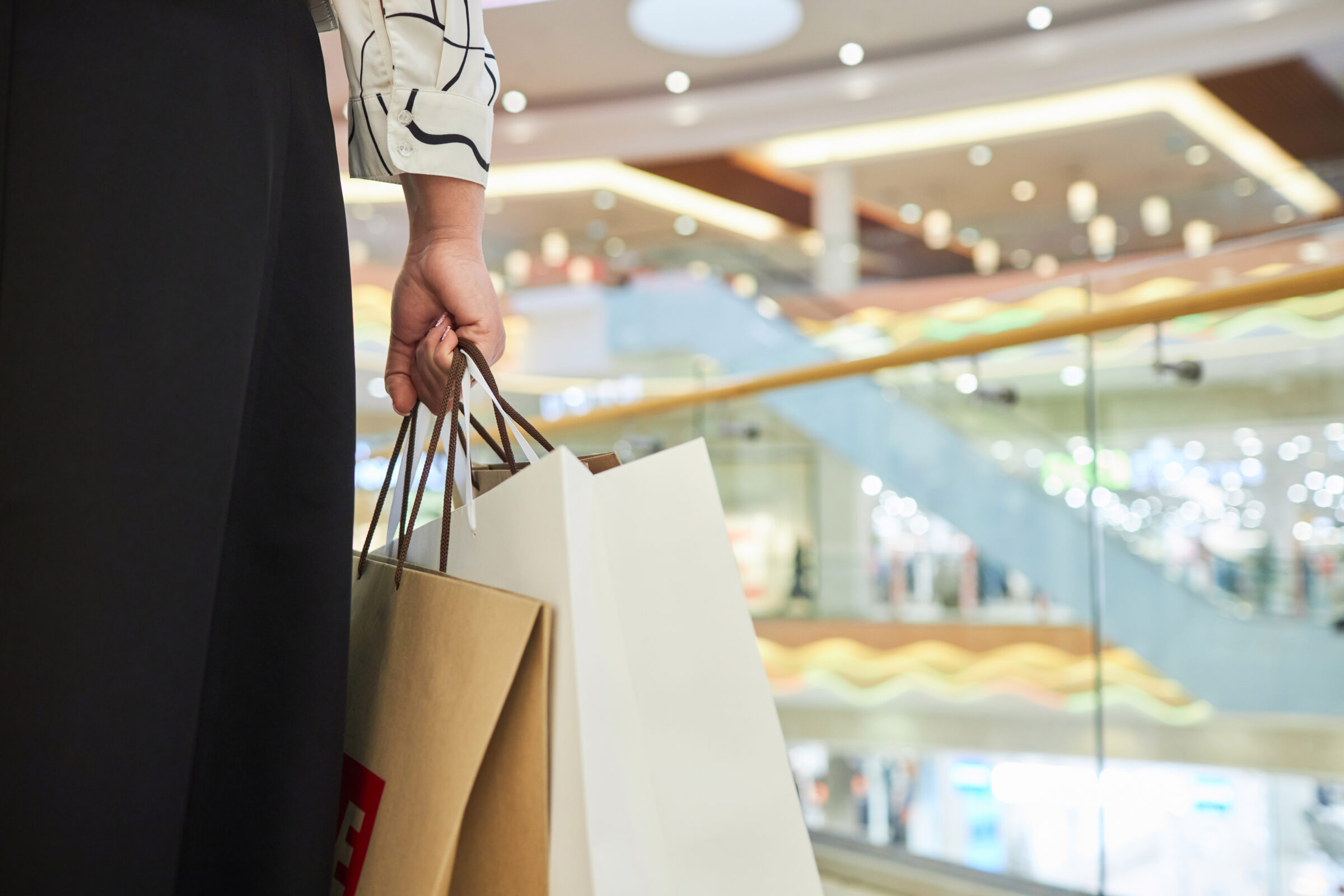 Woman Holding Paper Bags In Mall