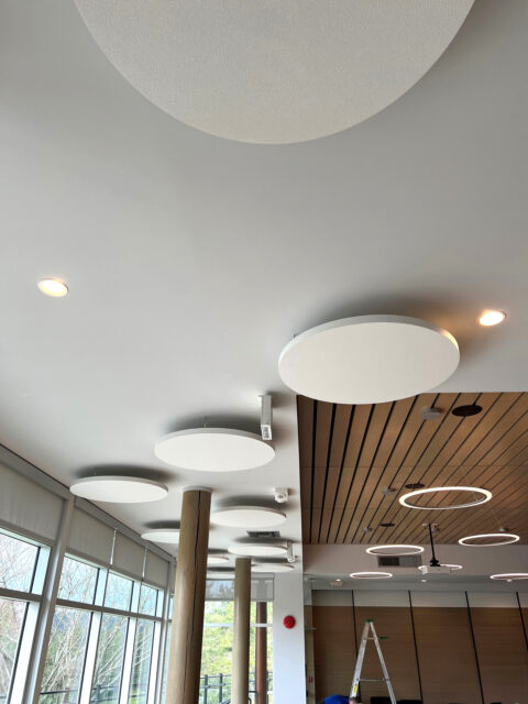 White acoustic halo cloud panels installed on ceiling