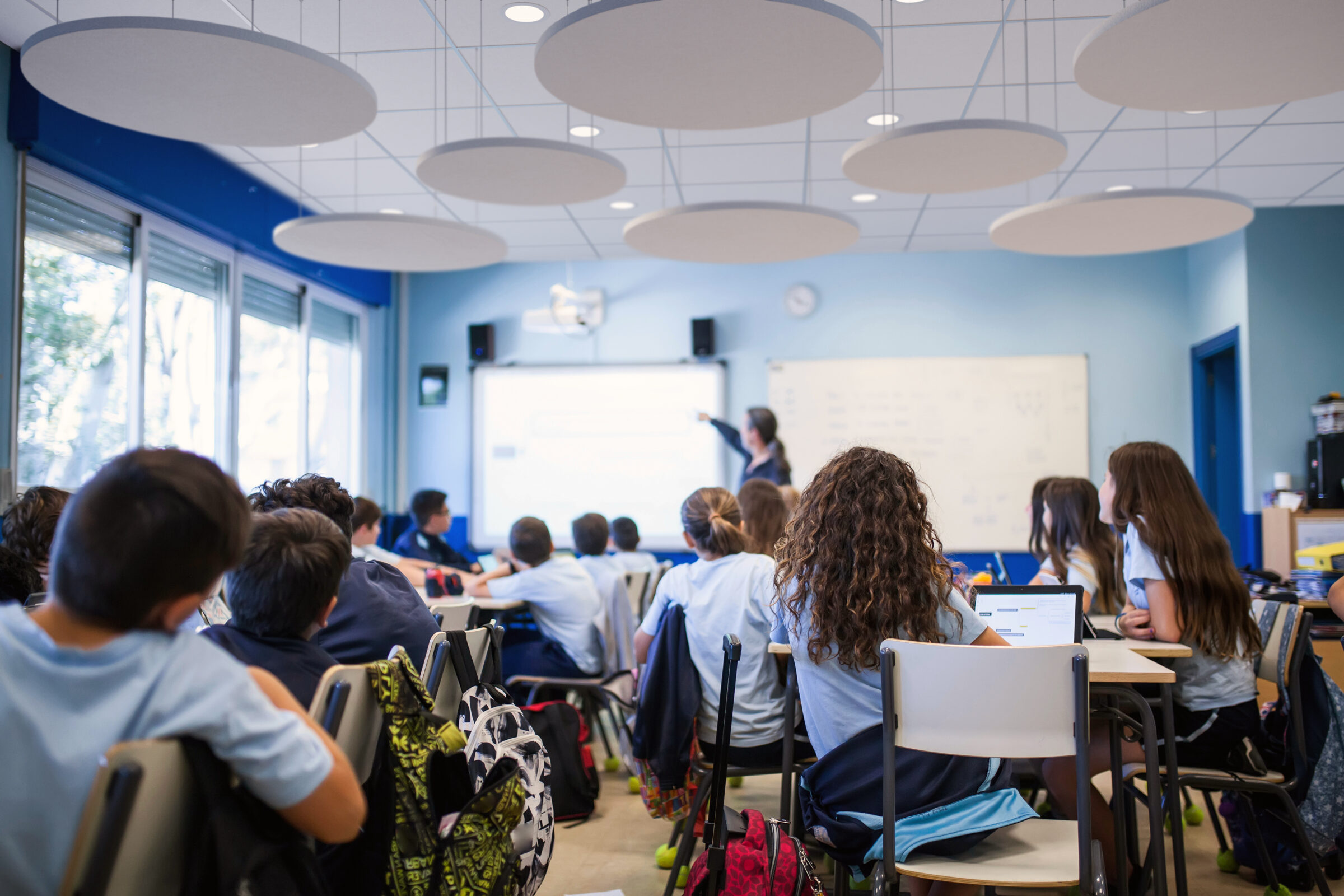 Classroom with students studying and acoustic panels